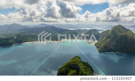 Top view of coastal town with boats floating over turquoise water. El Nido, Palawan. Philippines. Top view of coastal town with boats floating over turquoise water. El Nido, Palawan. Philippines. 113285407