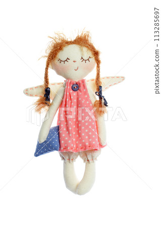 Handmade doll sleeping girl holding pillow isolated on white background, kid toy Handmade doll sleeping girl holding pillow isolated on white background, kid toy 113285697