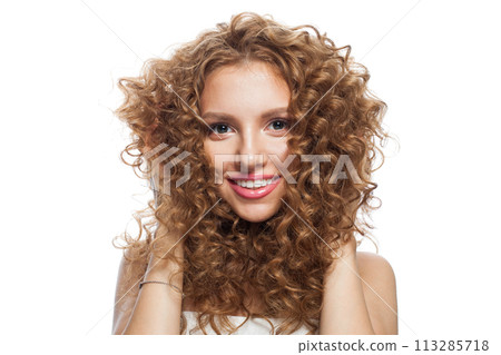 Gorgeous fashion model with frizzy hair, natural makeup and healthy clean skin posing Gorgeous fashion model with frizzy hair, natural makeup and healthy clean skin posing 113285718