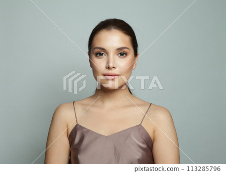 Elegant model woman with natural make-up, healthy skin.  113285796