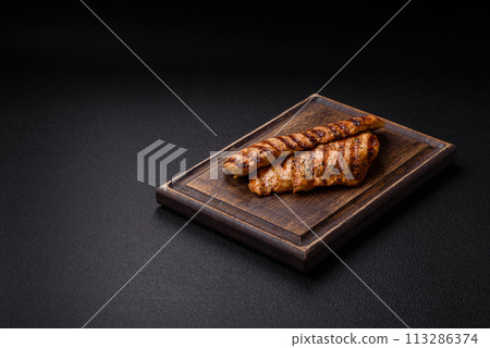 Delicious fresh grilled chicken fillet with spices and herbs 113286374