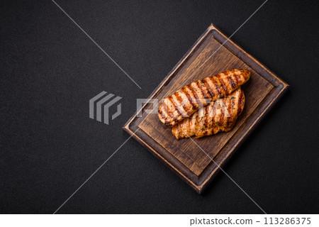 Delicious fresh grilled chicken fillet with spices and herbs 113286375