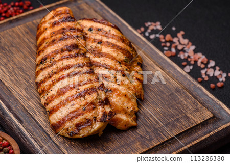 Delicious fresh grilled chicken fillet with spices and herbs 113286380