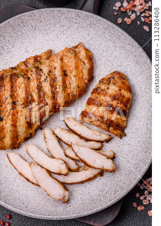 Delicious fresh grilled chicken fillet with spices and herbs 113286408