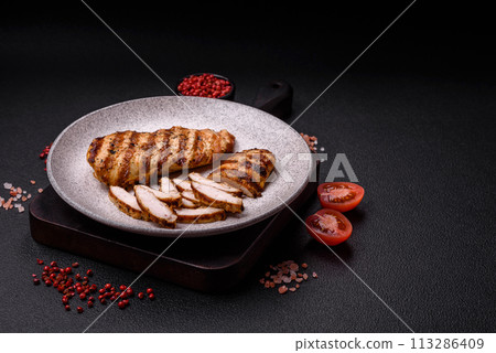 Delicious fresh grilled chicken fillet with spices and herbs 113286409