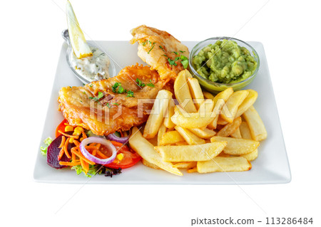 Traditionally a Mediterranean dish of fried fish and fries with salad and sauces. Close-up on a white background. Traditionally a Mediterranean dish of fried fish and fries with salad and sauces. Close-up on a white background. 113286484