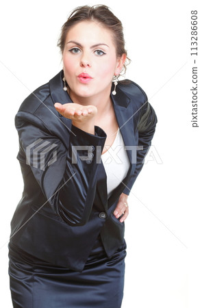 beautiful young woman blowing a kiss 113286608