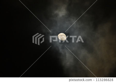 Moon age 10.2 A hazy moon between the clouds, the evening moon 113286828