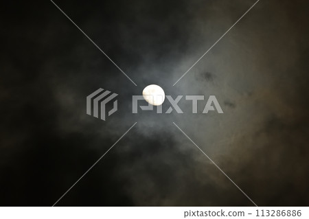 Moon age 10.2 A hazy moon between the clouds, the evening moon 113286886