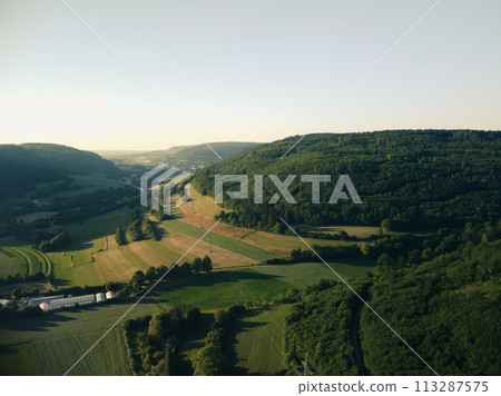 Aerial view on small town - colorful fields and trees in autumn 113287575
