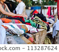 Heap colorful Indian textiles and clothing for  shopping 113287624