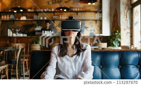 A young girl experiences virtual reality in quiet cozy cafe. Modern innovative technologies in everyday life, education, entertainment, psychological reboot A young girl experiences virtual reality in quiet cozy cafe. Modern innovative technologies in everyday life, education, entertainment, psychological reboot 113287870