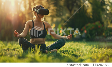 A woman practices meditation with a VR headset in a quiet garden, sitting in the lotus position on green lawn. Psychological health, relaxation, spiritual practices A woman practices meditation with a VR headset in a quiet garden, sitting in the lotus position on green lawn. Psychological health, relaxation, spiritual practices 113287979