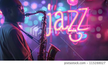 A jazz musician plays the saxophone in evening, against the backdrop of an illuminated neon "Jazz" sign. Jazz Appreciation Month, Club Life A jazz musician plays the saxophone in evening, against the backdrop of an illuminated neon "Jazz" sign. Jazz Appreciation Month, Club Life 113288027