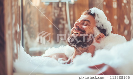 A calm, relaxed man enjoys a soothing bubble bath, reflecting a tranquil self-care routine. Soft masculinity, skin care, mental wellbeing A calm, relaxed man enjoys a soothing bubble bath, reflecting a tranquil self-care routine. Soft masculinity, skin care, mental wellbeing 113288166