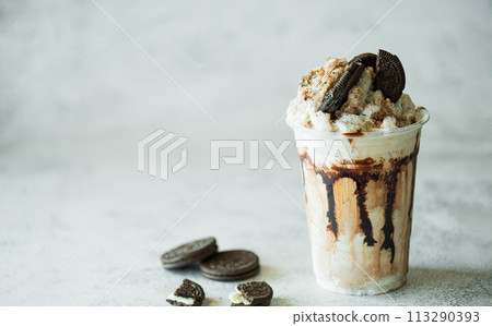 Chocolate milk shakes with cinnamon, chocolate pieces and various spices on stone background. Chocolate milk shakes with cinnamon, chocolate pieces and various spices on stone background. 113290393