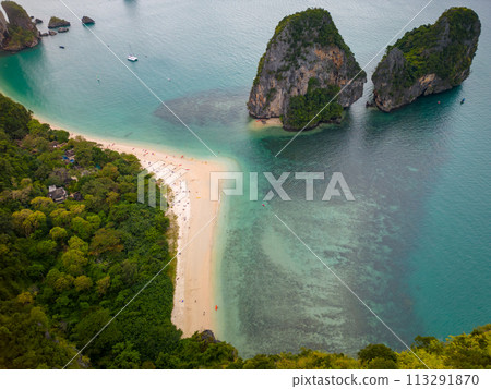 An aerial view of the Phra Nang beach of water surrounded by mountains 113291870
