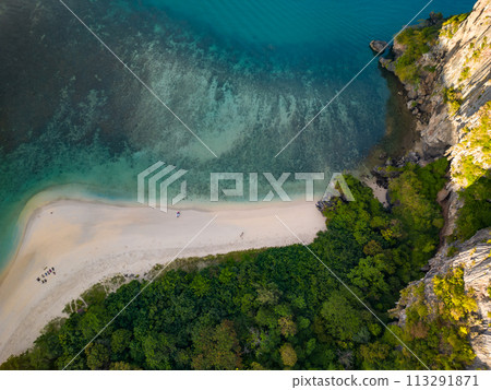 An aerial view of the Phra Nang beach of water surrounded by mountains An aerial view of the Phra Nang beach of water surrounded by mountains 113291871