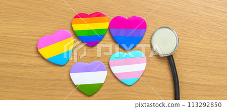 LGBT pride month concept or LGBTQ+ or LGBTQIA+. rainbow and colorful heart shape with Stethoscope for Lesbian, Gay, Bisexual, Transgender, Queer and Pansexual community LGBT pride month concept or LGBTQ+ or LGBTQIA+. rainbow and colorful heart shape with Stethoscope for Lesbian, Gay, Bisexual, Transgender, Queer and Pansexual community 113292850