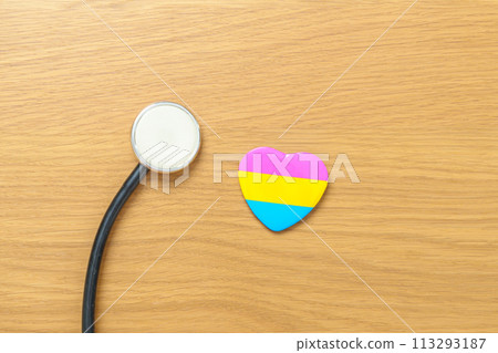 Pansexual Pride Day and LGBT pride month concept. pink, yellow and blue heart shape with Stethoscope for Lesbian, Gay, Bisexual, Transgender, Queer and Pansexual community 113293187