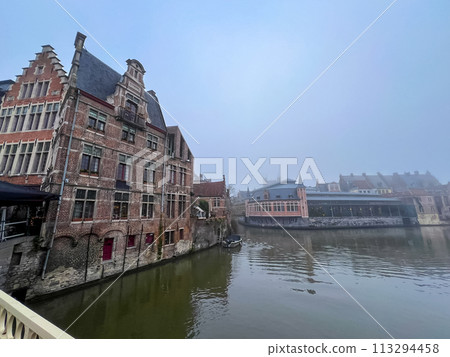 Beautiful medieval architecture and canal in ghent, belgian waterfront view Beautiful medieval architecture and canal in ghent, belgian waterfront view 113294458