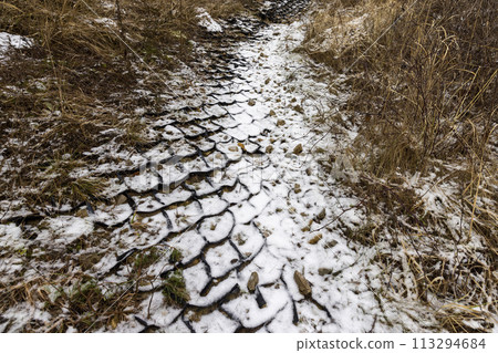 plastic geogrid on the riverbank in the hills plastic geogrid on the riverbank in the hills 113294684