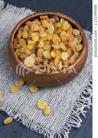 golden raisins on the kitchen table 113294986