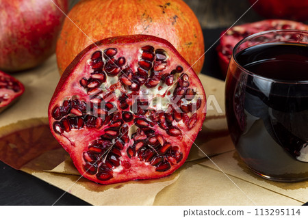 ripe red pomegranate on the table ripe red pomegranate on the table 113295114