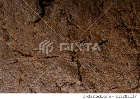 dark square loaf of bread on the table dark square loaf of bread on the table 113295137