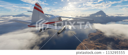 Airplane flying over mountains, lakes, and clouds. Sunny Da 113295555
