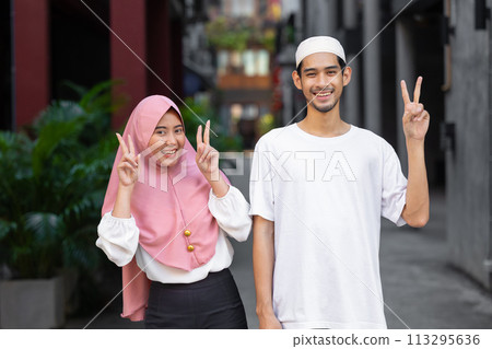 portrait happy muslim teen man and women couple lover friend standing together enjoy fun lifestyle outdoors 113295636