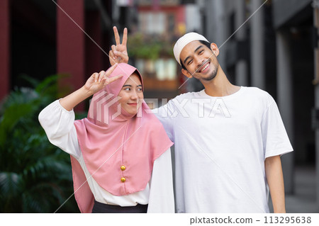 portrait happy muslim teen man and women couple lover friend standing together enjoy fun lifestyle outdoors portrait happy muslim teen man and women couple lover friend standing together enjoy fun lifestyle outdoors 113295638