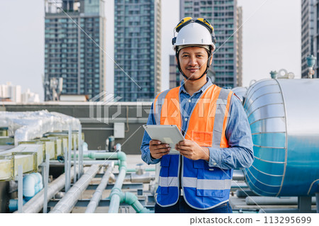 portrait happy smiling engineer male work work check water boiler tank pipe inspecting valve testing water pump job. portrait happy smiling engineer male work work check water boiler tank pipe inspecting valve testing water pump job. 113295699