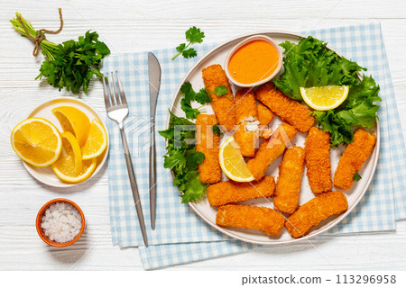 crispy fried breaded fish sticks on a plate crispy fried breaded fish sticks on a plate 113296958