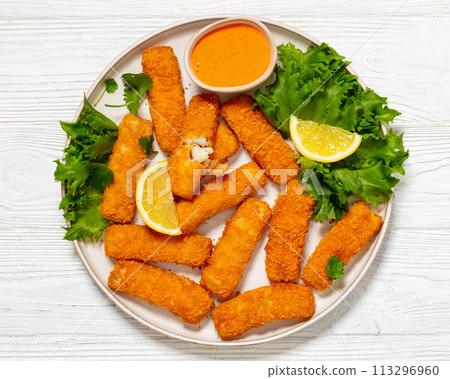 crispy fried breaded fish sticks on a plate crispy fried breaded fish sticks on a plate 113296960