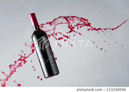 Bottle of red wine and splashes. 113298046