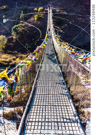 The Punakha Suspension Bridge at the Punakha Dzong in Bhutan. 113298486