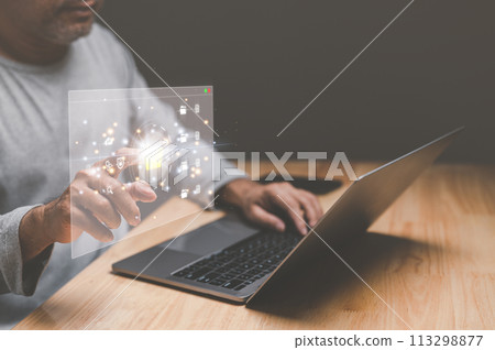 Businessman working from home using laptop with virtual screen. Process data and manage files on Internet efficiently. Online document database system and electronic document management system concept 113298877