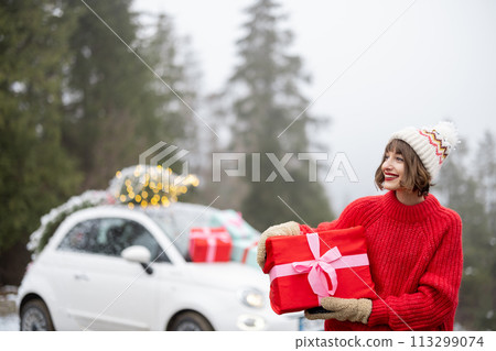 Woman travels by car during winter holidays Woman travels by car during winter holidays 113299074
