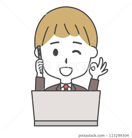 A man in a suit making an OK sign while making a phone call in front of a computer A man in a suit making an OK sign while making a phone call in front of a computer 113299304