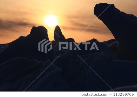 Sunset on the Okhotsk coast in Hokkaido in winter 113299709