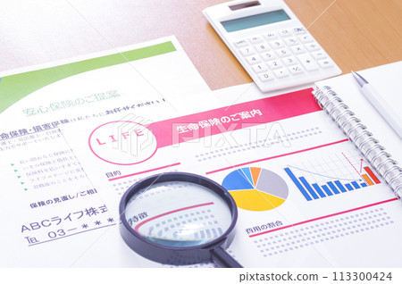 Image of considering and reviewing medical insurance and life insurance Image of considering and reviewing medical insurance and life insurance 113300424