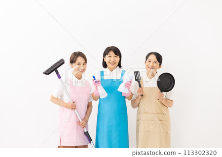 Woman in apron housekeeping Woman in apron housekeeping 113302320