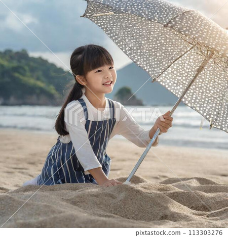 Girl holding a parasol on the beach 113303276