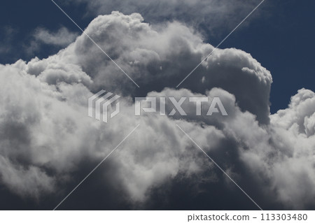 Cloudscape scenery, overcast weather above dark blue sky. Storm clouds floating in a rainy dull day with natural light. White and grey scenic environment background. Nature view. 113303480