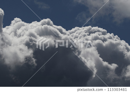 Cloudscape scenery, overcast weather above dark blue sky. Storm clouds floating in a rainy dull day with natural light. White and grey scenic environment background. Nature view. 113303481