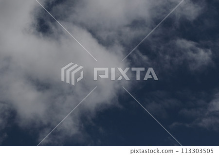 Cloudscape scenery, overcast weather above dark blue sky. Storm clouds floating in a rainy dull day with natural light. White and grey scenic environment background. Nature view. Cloudscape scenery, overcast weather above dark blue sky. Storm clouds floating in a rainy dull day with natural light. White and grey scenic environment background. Nature view. 113303505