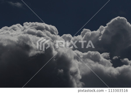 Cloudscape scenery, overcast weather above dark blue sky. Storm clouds floating in a rainy dull day with natural light. White and grey scenic environment background. Nature view. Cloudscape scenery, overcast weather above dark blue sky. Storm clouds floating in a rainy dull day with natural light. White and grey scenic environment background. Nature view. 113303516
