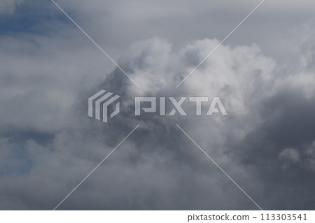 Cloudscape scenery, overcast weather above dark blue sky. Storm clouds floating in a rainy dull day with natural light. White and grey scenic environment background. Nature view. Cloudscape scenery, overcast weather above dark blue sky. Storm clouds floating in a rainy dull day with natural light. White and grey scenic environment background. Nature view. 113303541