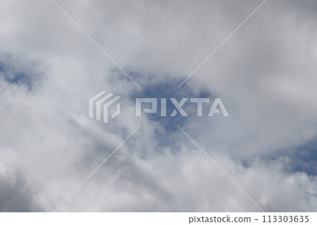 Cloudscape scenery, overcast weather above dark blue sky. Storm clouds floating in a rainy dull day with natural light. White and grey scenic environment background. Nature view. Cloudscape scenery, overcast weather above dark blue sky. Storm clouds floating in a rainy dull day with natural light. White and grey scenic environment background. Nature view. 113303635
